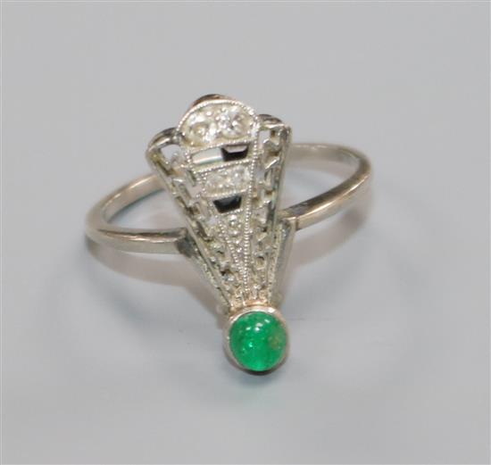 An Art Deco white metal, diamond, cabochon emerald and black onyx? dress ring (a.f.), size L.